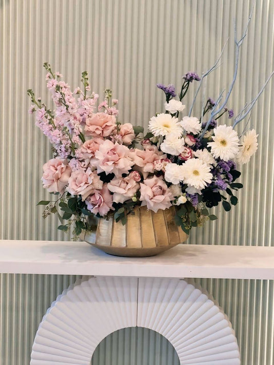 Elegant floral centerpiece with soft pink and white flowers – available in GTA