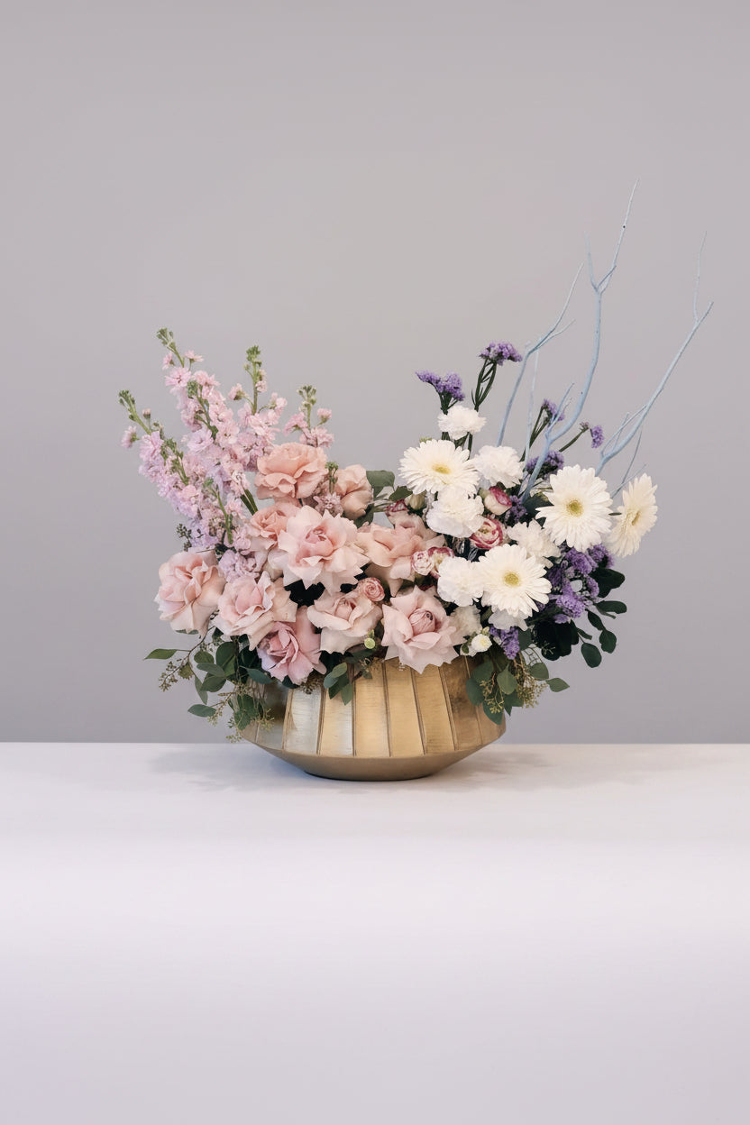 Elegant floral centerpiece with soft pink and white flowers – available in GTA