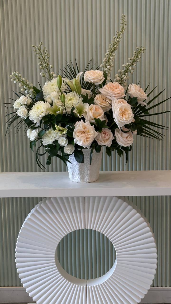 "Large white floral arrangement with tropical greens β available in Aurora & GTA"