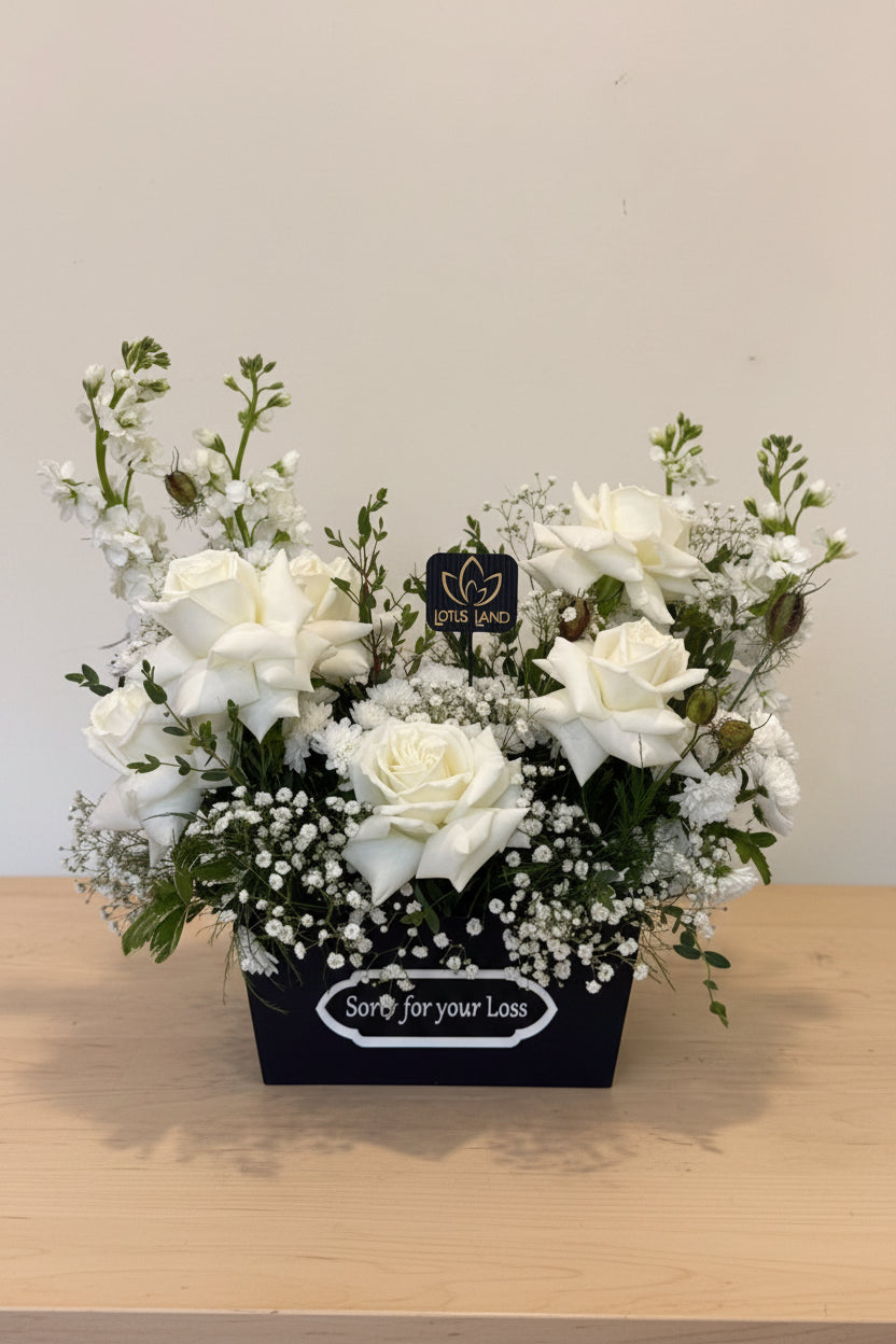 white sympathy flower box with roses condolence arrangement aurora florist