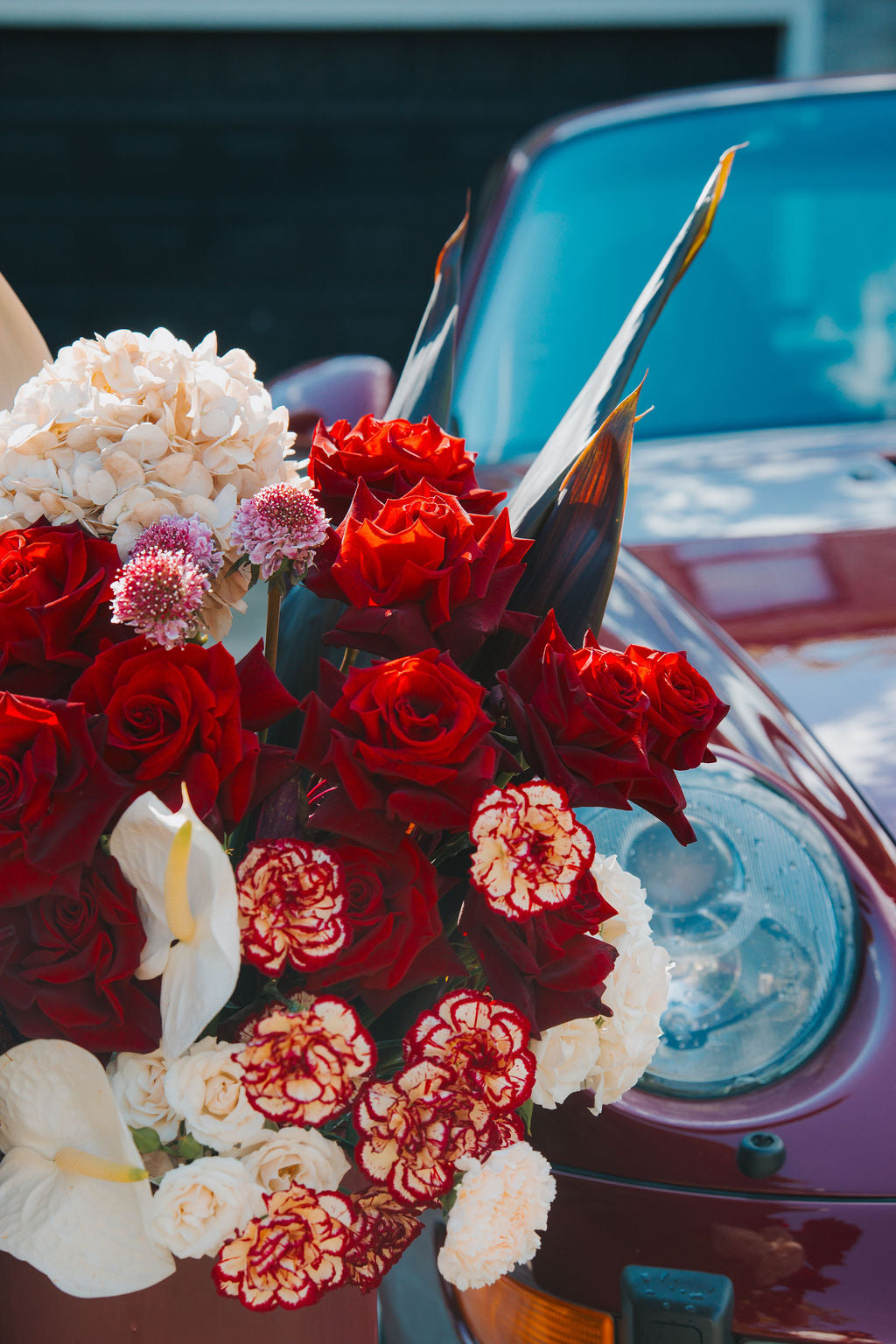 Luxury red floral arrangement in burgundy box
