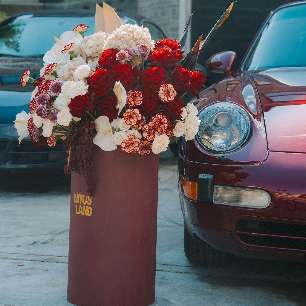 Luxury red floral arrangement in burgundy box
