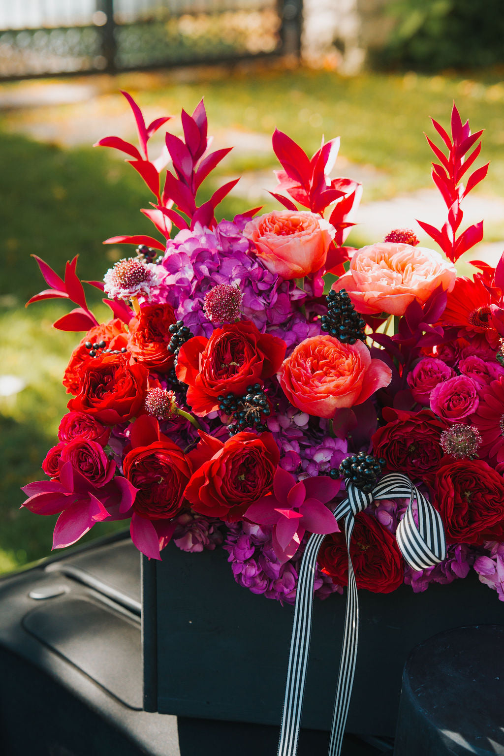 Luxury floral box arrangement in a black box with rich tones and modern elegance