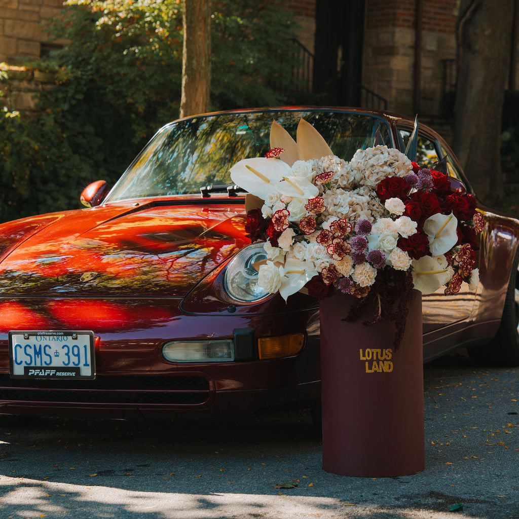 Luxury red floral arrangement in burgundy box