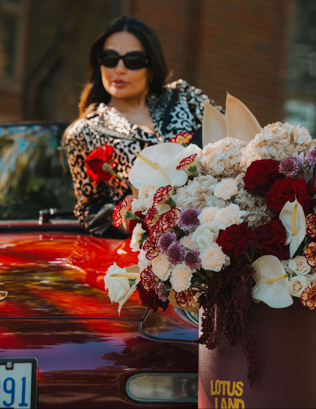 Luxury red floral arrangement in burgundy box