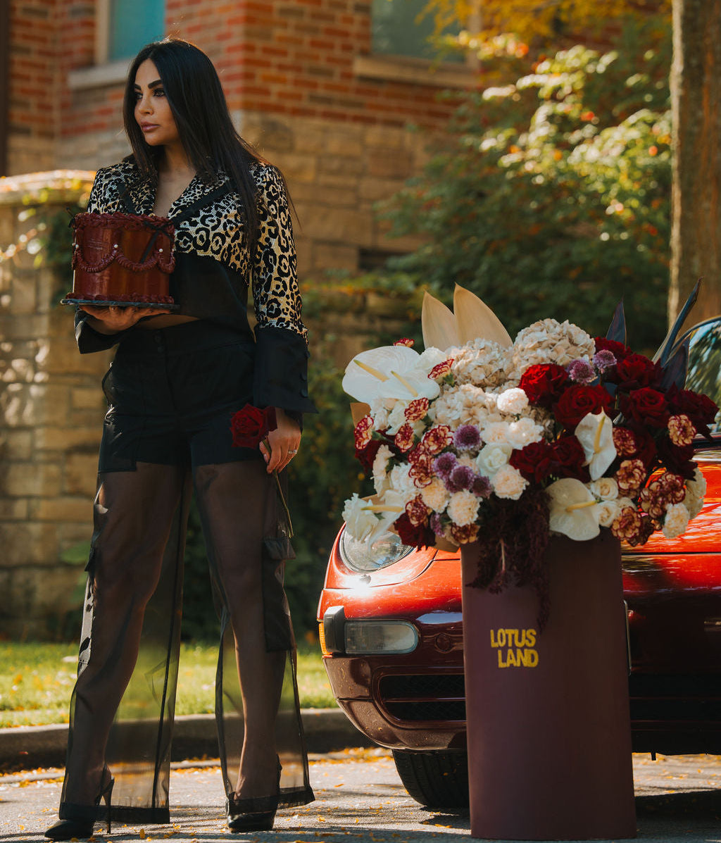 Luxury red floral arrangement in burgundy box