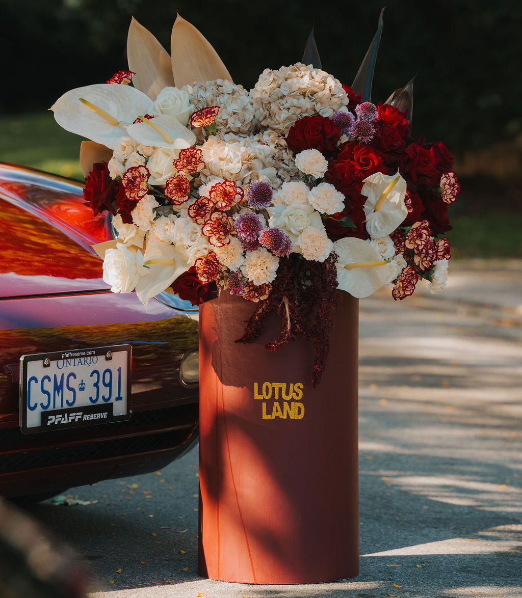 Luxury red floral arrangement in burgundy box