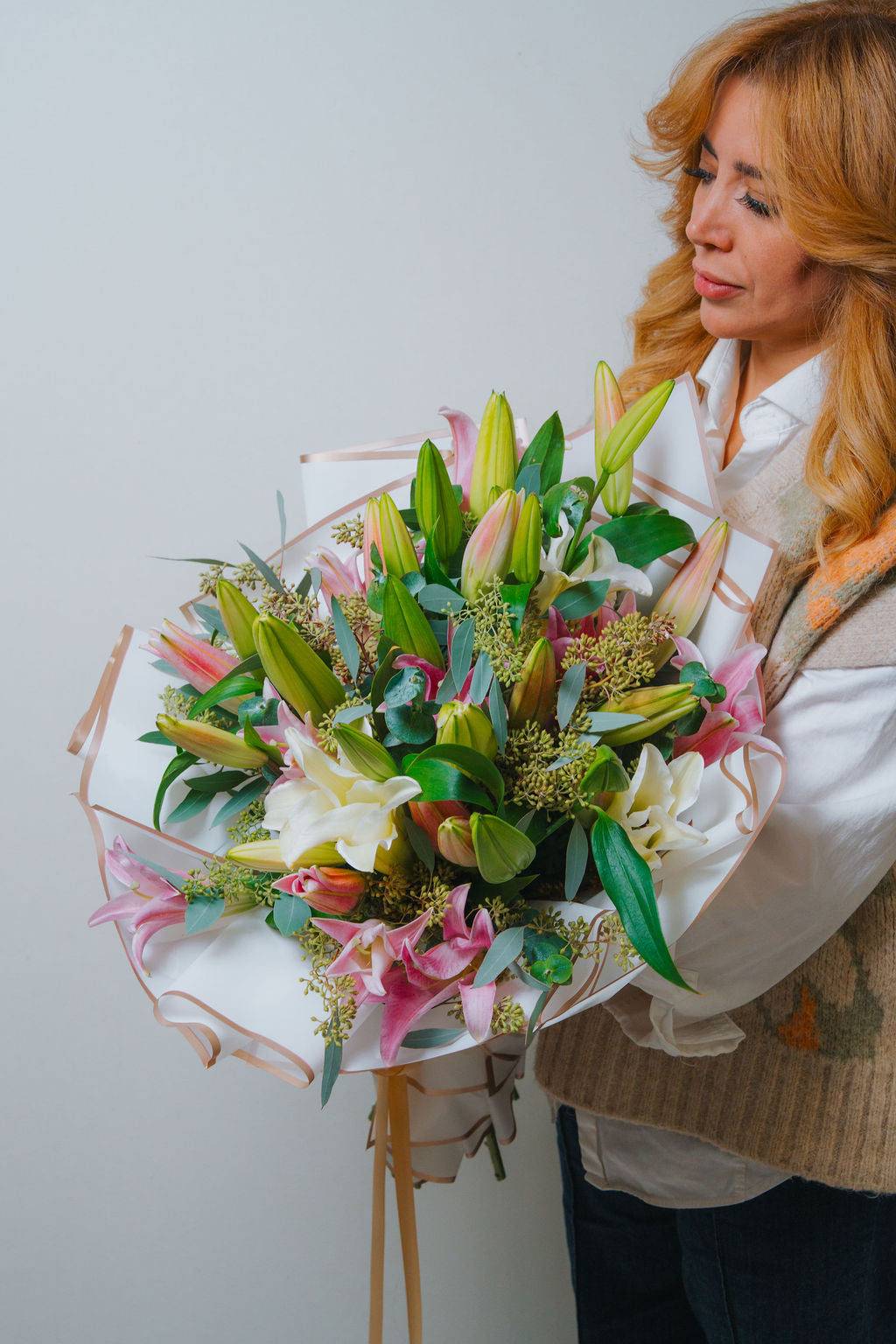 Luxury pink and white lily bouquet with eucalyptus and elegant wrapping 