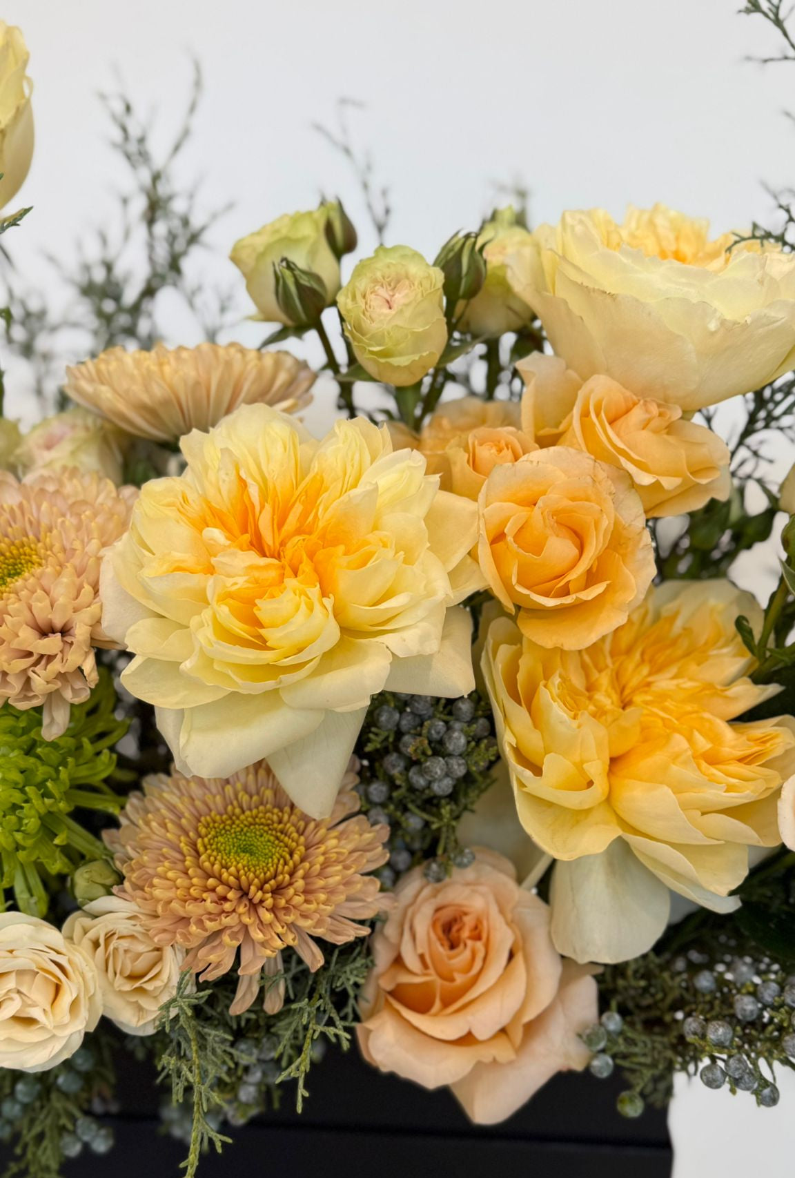 “Luxury yellow flower box with roses and seasonal flowers ”