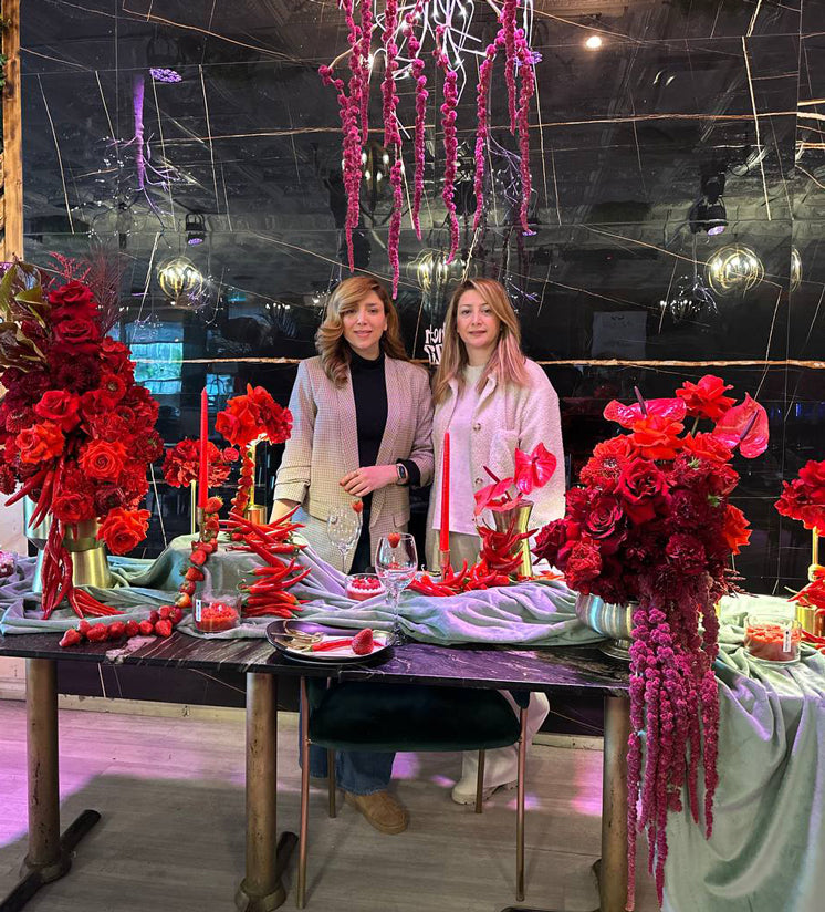 “Contemporary red floral sculpture with roses, chili peppers, and textured styling for a luxury Valentine’s Day event in Toronto