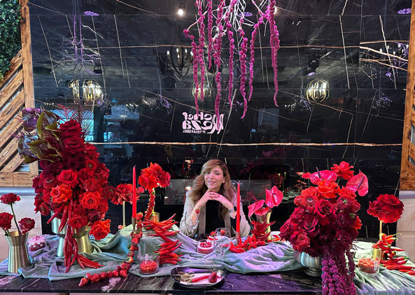 “Contemporary red floral sculpture with roses, chili peppers, and textured styling for a luxury Valentine’s Day event in Toronto