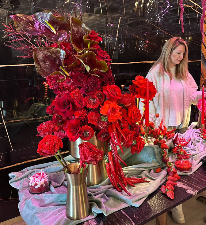 Contemporary red floral sculpture with roses, chili peppers, and textured styling for a luxury Valentine’s Day event in Toronto. lotus land flower 