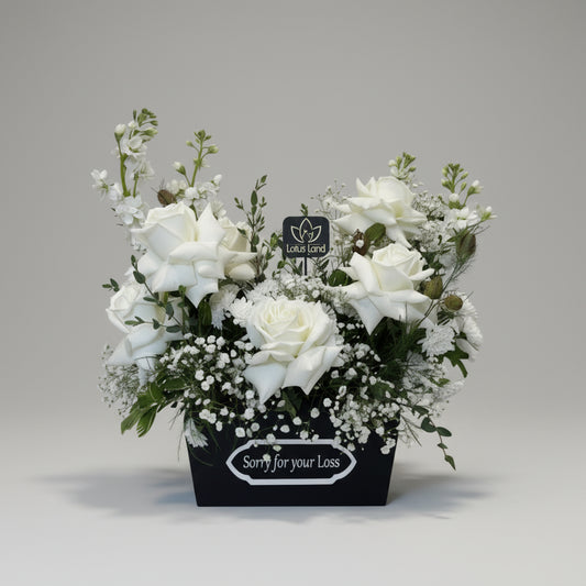 white sympathy flower box with roses condolence arrangement aurora florist
